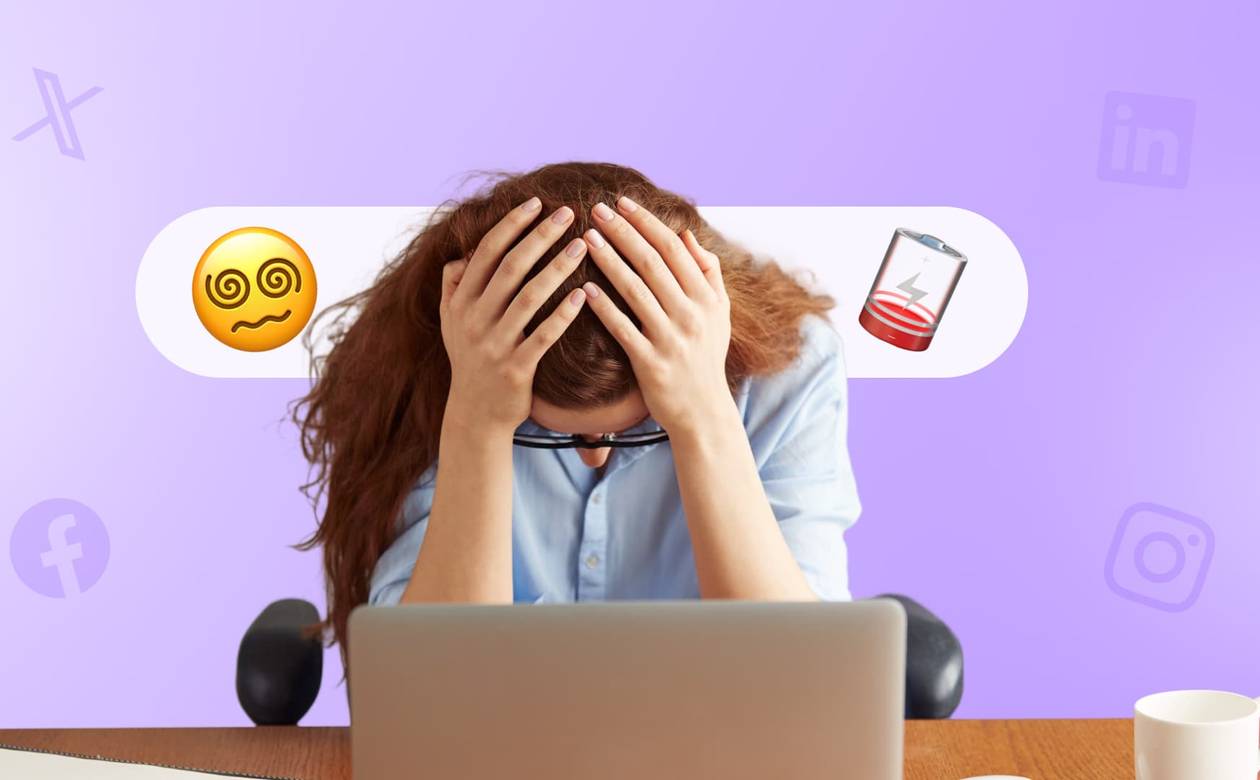 An illustration of a social media manager with her head in her hands in front of a computer suffering from burnout.